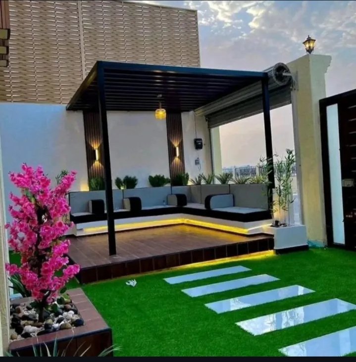 تصميم مجلس سطح خارجي مع برجولة وعشب صناعي وإضاءة -زهرة البستان لتنسيق حدائف